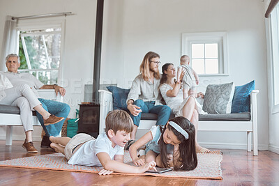 Buy stock photo Shot of a family bonding in the lounge together