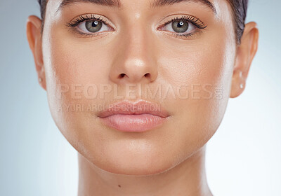 Buy stock photo Closeup portrait of beautiful woman with smooth glowing face. Headshot of caucasian model isolated against a grey background in studio and posing. Young woman with healthy skin and routine skincare