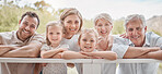Portrait happy smiling caucasian family standing together in the garden at home. Little girls bonding with their mother, father, grandfather and grandmother in a backyard