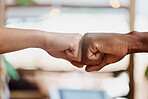 Closeup shot of two businesspeople fist bumping. Two unknown partners starting a new business together, diverse men agree and motivate each other against a bright background with copyspace 