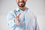 Closeup of one business man extending hand forward to greet and welcome with handshake. Networking and meeting for interview to agree on deal or offer. Collaborating on negotiation for job promotion