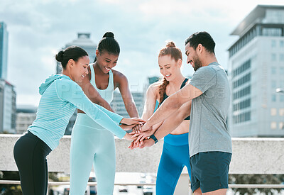 Buy stock photo Diverse group of happy sporty people stacking hands together in pile to express unity and support. Motivated athletes huddled in circle for encouraging workout pep talk. Joining for collaboration, team spirit and dedication for training workout in city