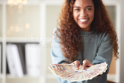 Buy stock photo One happy young mixed race woman holding cash with two hands and feeling rich. Excited hispanic woman showing money after budgeting finances and saving. Planning for the future or winning a lottery