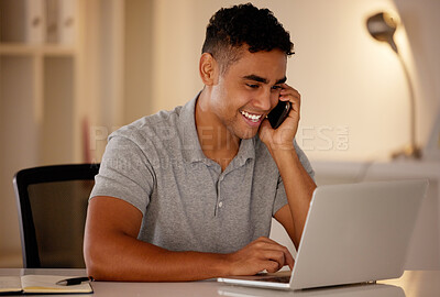 Buy stock photo One young mixed race business man multitasking by talking on a cellphone and using a laptop to browse the internet. Happy, ambitious entrepreneur using technology to work on a startup in the evening