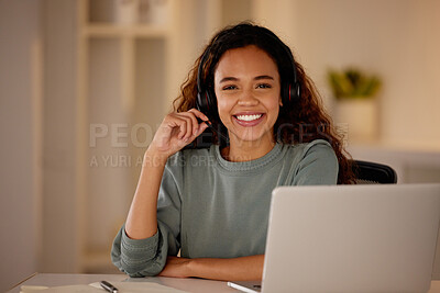 Buy stock photo One young woman using headset and working late on a laptop in an office. Happy woman doing freelance work as a call centre agent. Consultant operating a helpdesk for customer care, sales and support