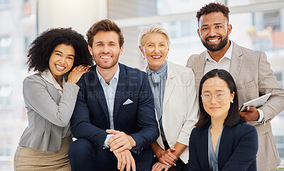 Buy stock photo Portrait of a group of confident diverse businesspeople posing together in an office. Happy smiling colleagues motivated and dedicated to success. Cheerful and ambitious corporate staff working closely together