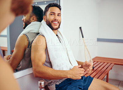 Buy stock photo Fit athlete sitting on a bench talking to his friend. Two friends taking a break in the gym. Players bonding and talking before a match. Professional players before a game practice