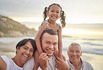 Happy mixed race family of four walking on the beach. A cute girl enjoying the sand and sea with their dad, grandfather and grandmother. Grandparents with their granddaughter and son outdoors