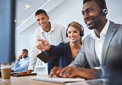 Buy stock photo Happy caucasian female call centre telemarketing agent discussing plans with diverse colleagues while working together on computer in an office. Consultants troubleshooting solution for customer service and sales support