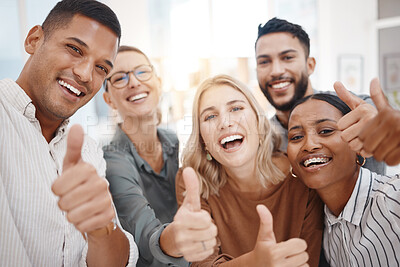Buy stock photo Portrait of a group of confident diverse businesspeople gesturing thumbs up and taking selfies together in an office. Happy colleagues smiling for photos and video call as a dedicated and ambitious team in a creative startup agency