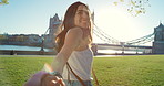 Happy young woman walking holding her partners hand on holiday in London