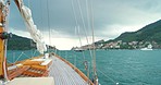 Yacht sailing around the coast of Liguria, Italy on a cloudy day. Boat on a cruise around the Italian coast on a cloudy day